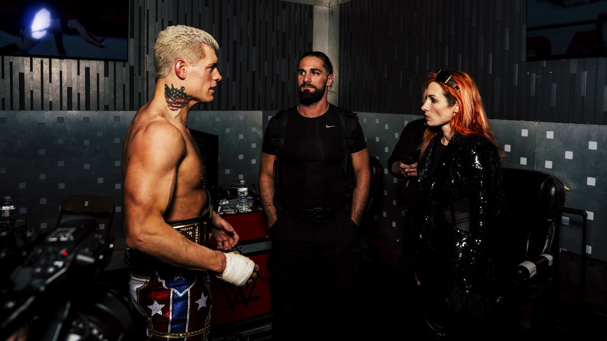 Cody Rhodes hanging out with Seth Rollins and Becky Lynch after winning the WWE title at Wrestlemania