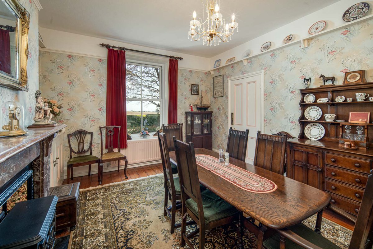 An attractive and substantial, non-listed, Georgian Farmhouse, built in 1733, enjoying sea views and set within sheltered gardens and grounds including an orchard and pond extending to 5.33 acres (2.16ha).