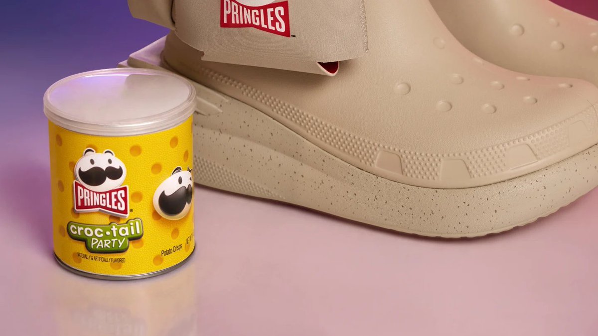 MorningBrew's tweet photo. Crocs just cooked up another insane collab—this time with Pringles 

• Classic Clog ($70)
• Classic Slide ($70)
• Boot w/Pringles holster ($100)

They also created an exclusive new Pringles flavor, available to anyone who makes a purchase from the collection https://t.co/jDAOl7Rd8z