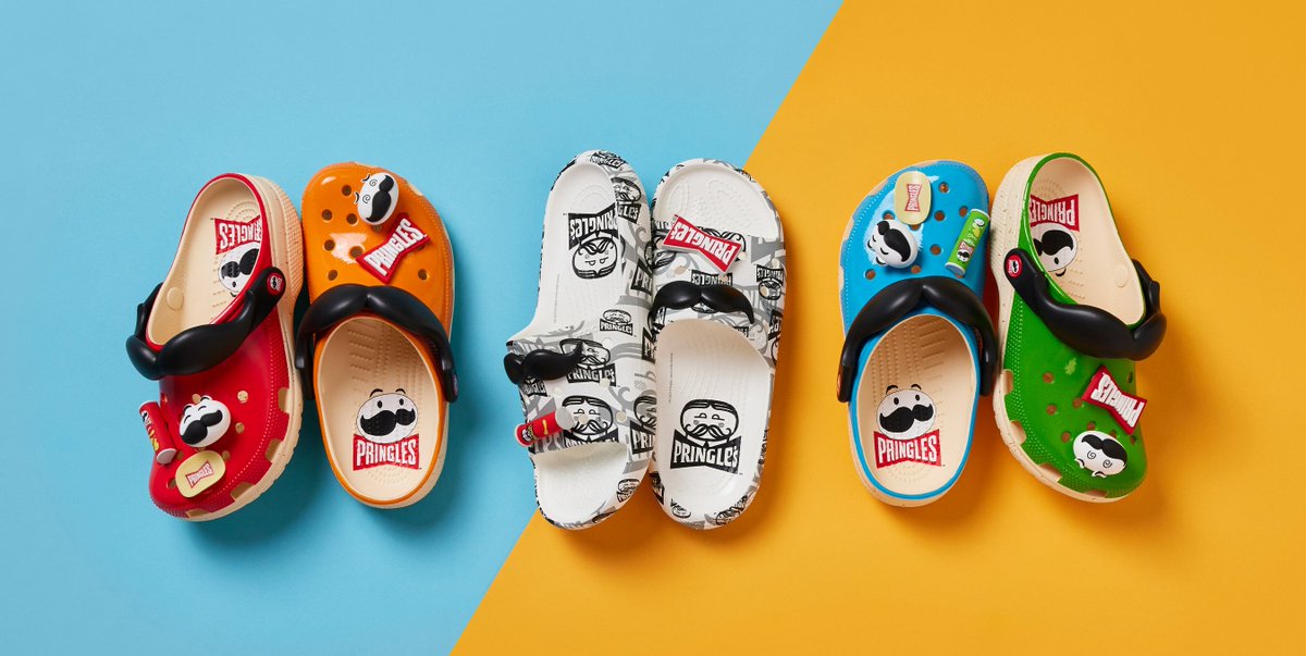 MorningBrew's tweet photo. Crocs just cooked up another insane collab—this time with Pringles 

• Classic Clog ($70)
• Classic Slide ($70)
• Boot w/Pringles holster ($100)

They also created an exclusive new Pringles flavor, available to anyone who makes a purchase from the collection https://t.co/jDAOl7Rd8z