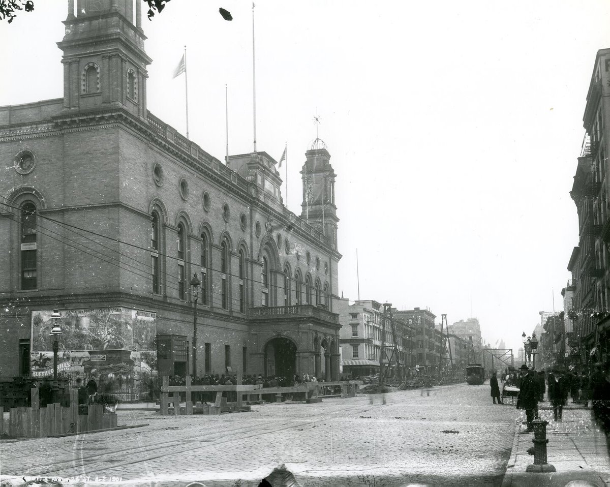 #TodayinHistory: Taken #OnThisDay in 1901, this remarkable #NYTMCollection photograph shows the second iteration of Madison Square Garden on 26th Street and Park Avenue South, complete with signage for Buffalo Bill's Wild West Show and a line of people waiting to see it.