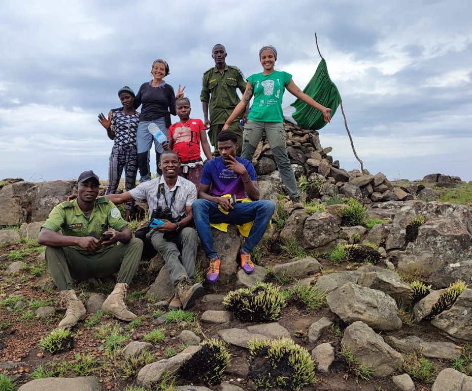 Tacugama's tweet image. This month our outreach team, Loma eco-guards, with the NPAA and local community members, climbed to the top of Bintumani Mountain, the highest peak in Sierra Leone at 1,945 meters! Would you want to climb this peak? Thanks to  #USForestService for their support in this mission!