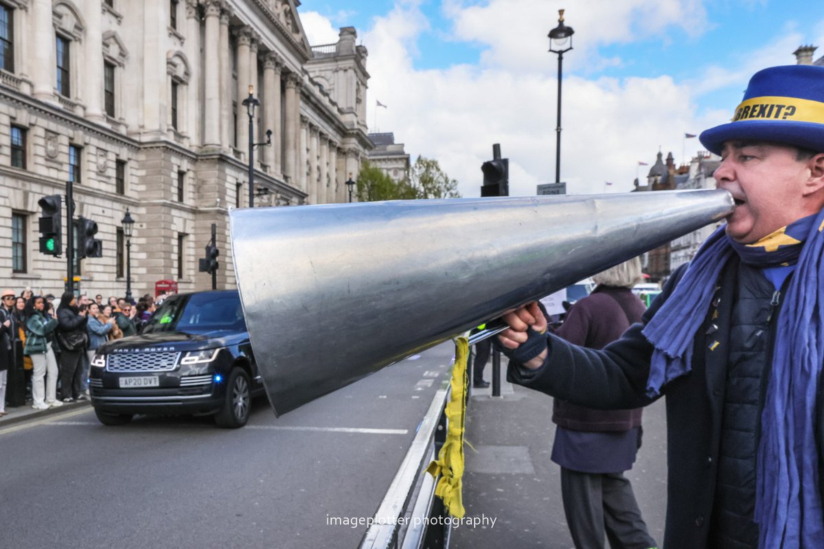 And a quick shot of Steve Bray from @SODEMAction swallowing up the PM's car on his way to PMQ's. They can take his amps, but they can't take is spirit, it seems. 😉 @snb19692 (sorry, bit blurry)