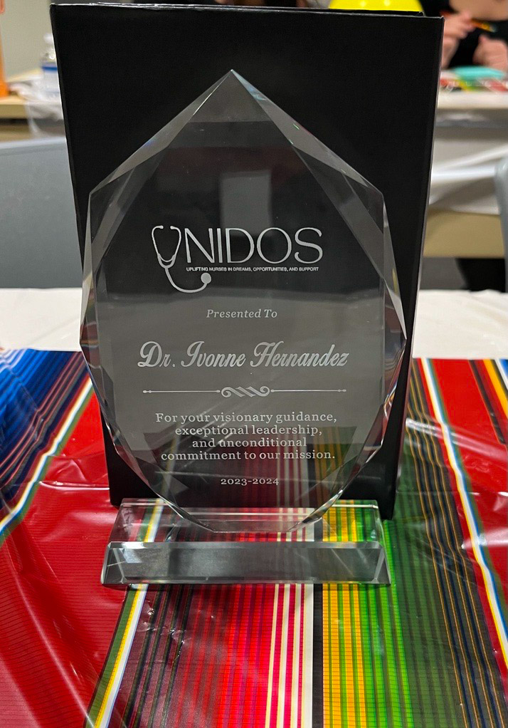 UNIDOS celebrated their first year as a student organization with a year-end banquet. 🎉 They reminisced with photos of the year's events, welcomed their new board, and thanked Dr. Ivonne Hernandez with an award for her invaluable guidance as faculty advisor.👏