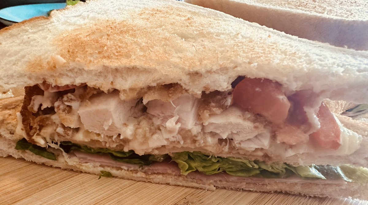 Club sandwiches tonight with chicken, ham, lettuce, tomato, melted cheese and mayo.
