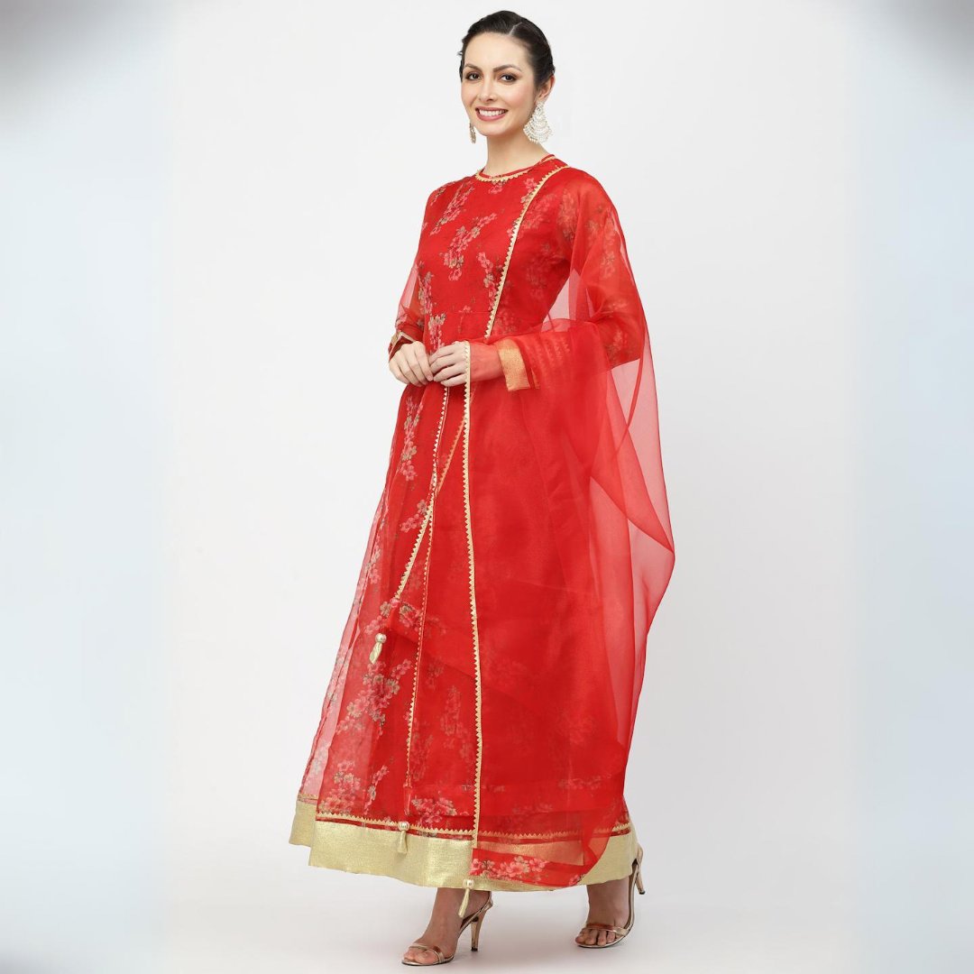 “Radiant in Red: Embrace tradition with this stunning ethnic anarkali paired with a gorgeous gotta patti dupatta and heavy tassels.
.
.
 #EthnicElegance #IndianFashion”
#RedAnarkali #GottaPattiDupatta #EthnicFashion #TraditionalWear #IndianOutfit #TasselLove