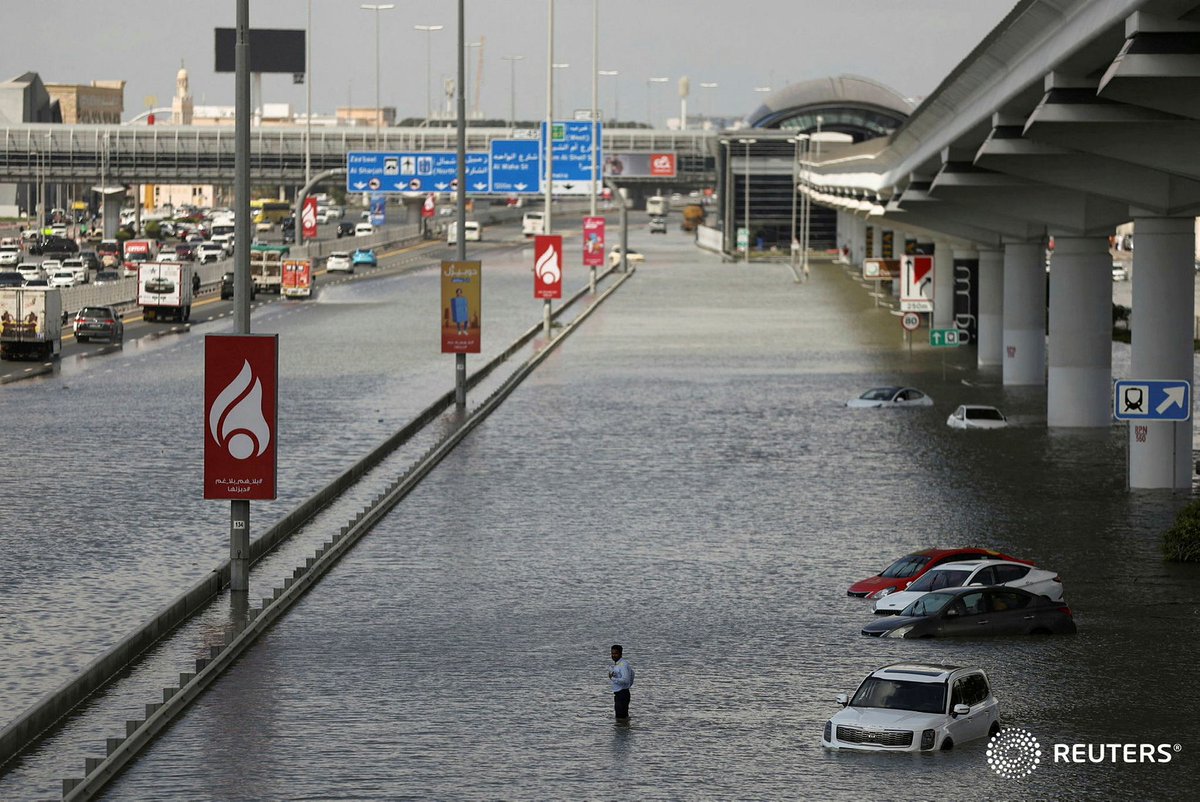 A person stands in flood water following heavy rains in Dubai, April 17, 2024. — <a href="/Reuters/">Reuters</a>