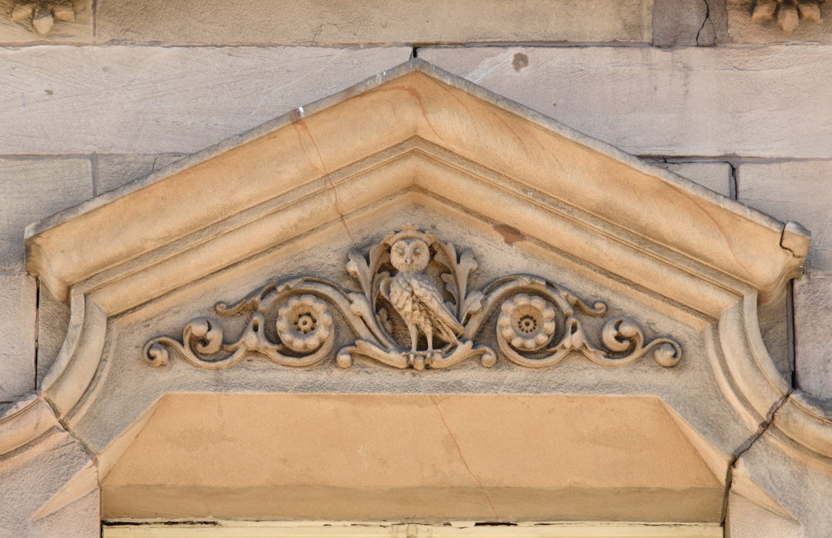 Fowler's Buildings, Victoria Street, originally Temple Court. Built 1866-69 as per date stones, with warehouses behind. The owl reflects the family name.