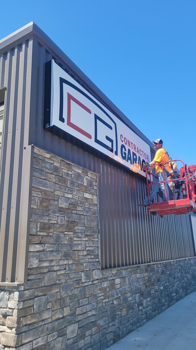 Fancy new Contractor Garage sign going up... taking advantage of highway visibility!