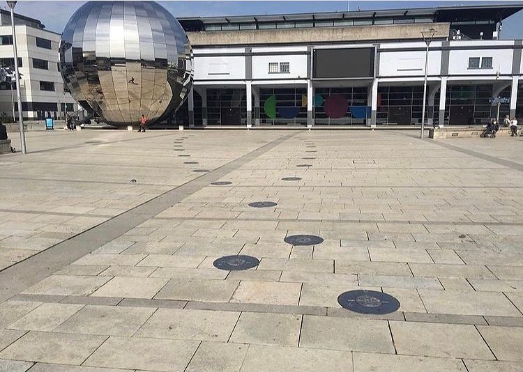 These marks in the ground of Millennium Square are an analemma. It traces the course of the sun at the same time of day throughout the duration of a year.