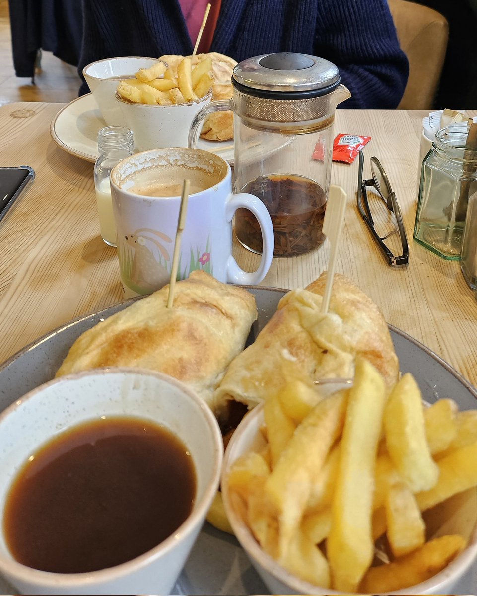 Best view in Grasmere: Two Yorkshire Pudding Wraps containing Sausages and Chips, with bucket of gravy, at Heidi's cafe. We two weary Londoners were contented.