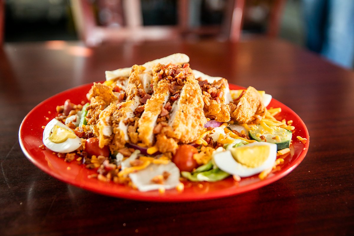 Craving a fresh and hearty salad? Try our Cobb Salad at Eller's Restaurant! Satisfy your taste buds with grilled or fried chicken tenders, chopped bacon, cheddar cheese, and hard boiled egg over a bed of crisp greens. #CobbSalad #FreshFlavors #EllersRestaurant 🍴