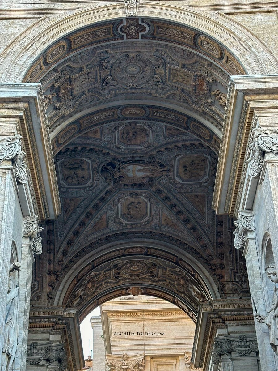 Details matter.  If the top of an archway is this special, you may imagine what the rest looks like. Left side of the Vatican. Archway guarded by the Swiss Guard.