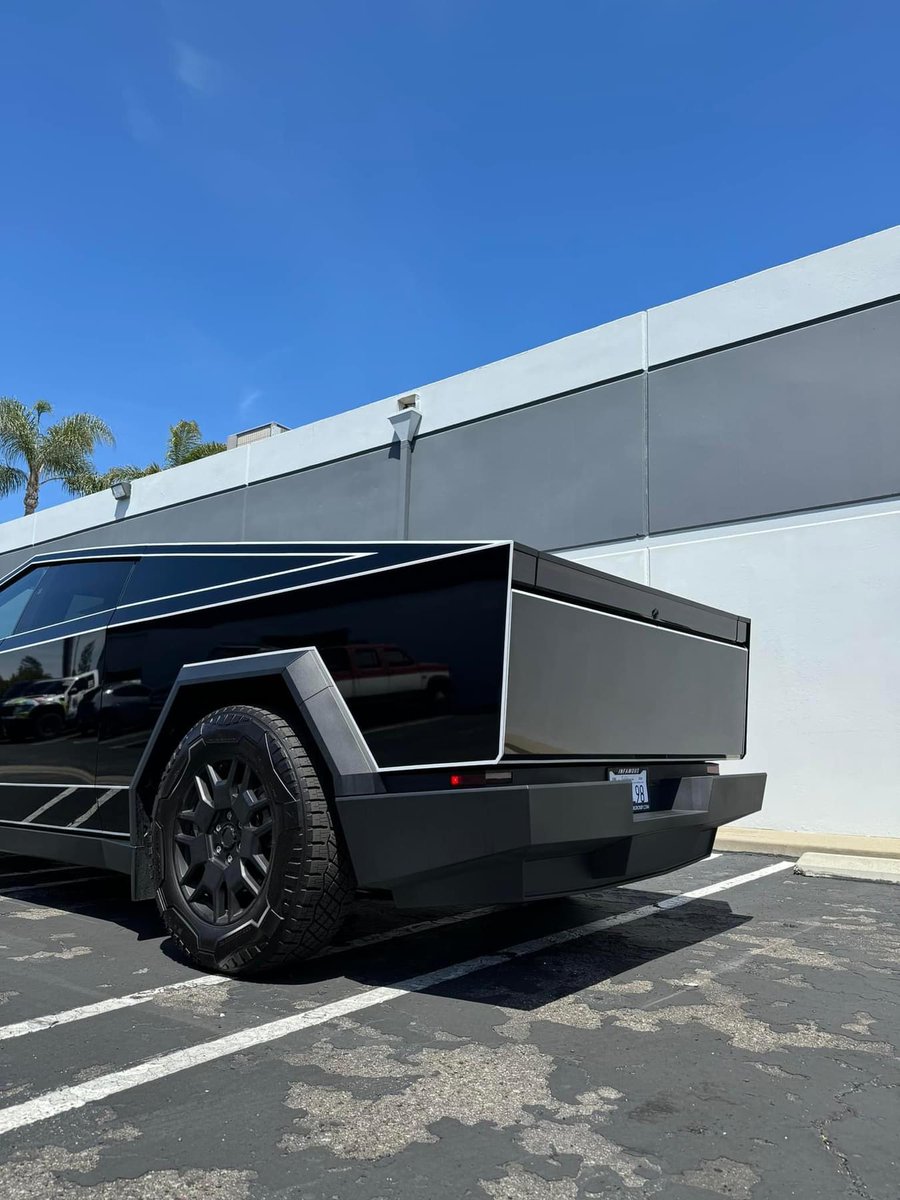 Supergloss black with reflective strips along the body lines to give this Cybertruck the TRON look. 

Out of Huntington Beach, CA. What do we think???