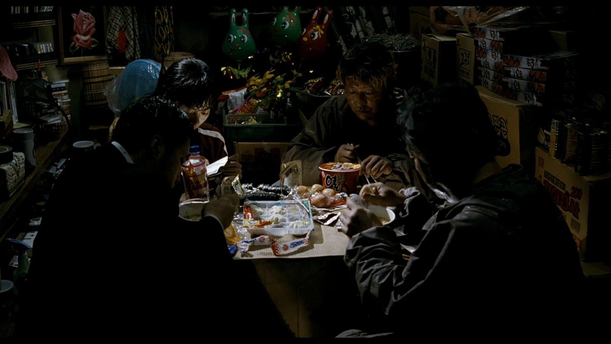 jadeincinema's tweet photo. In The Host (2006), this scene has three masks in the background, and it reminded me of the masks on the wall in The Housemaid (1960). I also believe it to be foreshadowing that there were only 3 survivors of the family at the end of the film. 

53:33 https://t.co/IR6fbR2dNZ