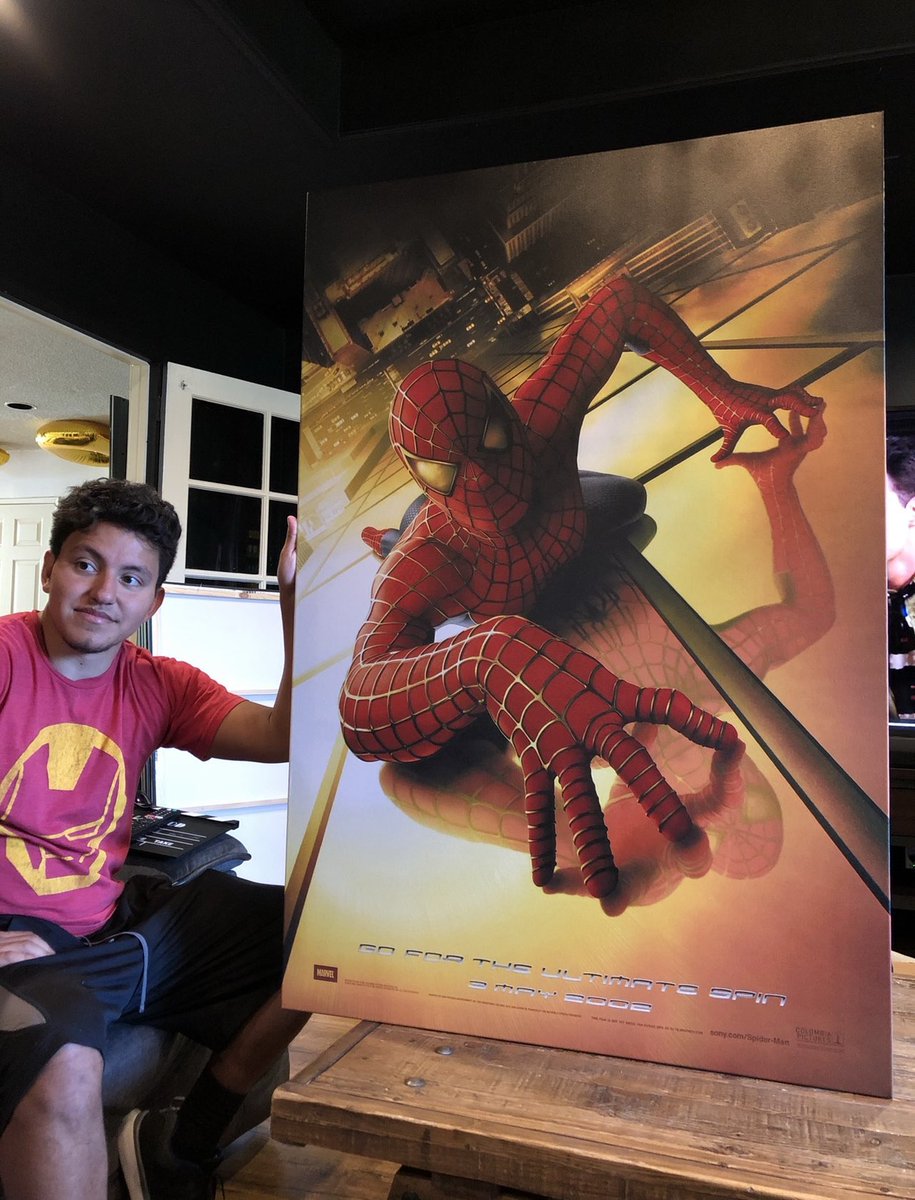My brother holding our Spider-Man poster ❤️