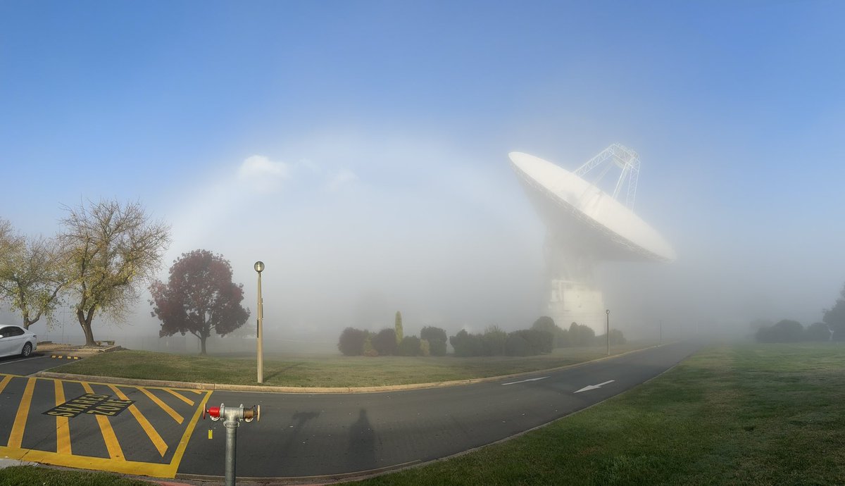 A fabulous ‘fog bow’ this morning as Deep Space Station 43 peaks through the morning mist here in our tracking station valley. 🌈🌫️📡 #fog #DSS43 #weather #Canberra