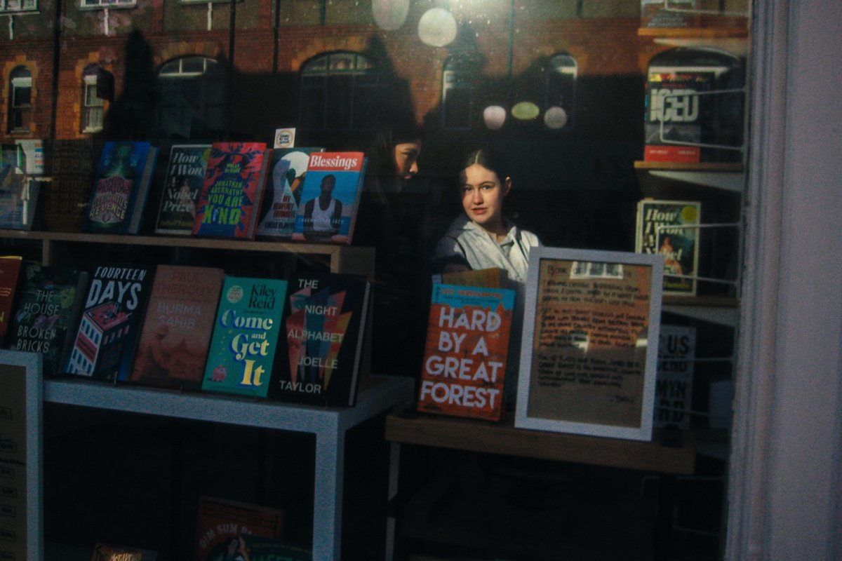 'Bookshop window'. #streetphotography #candid #people #film #grain #retro #liverpool #layers