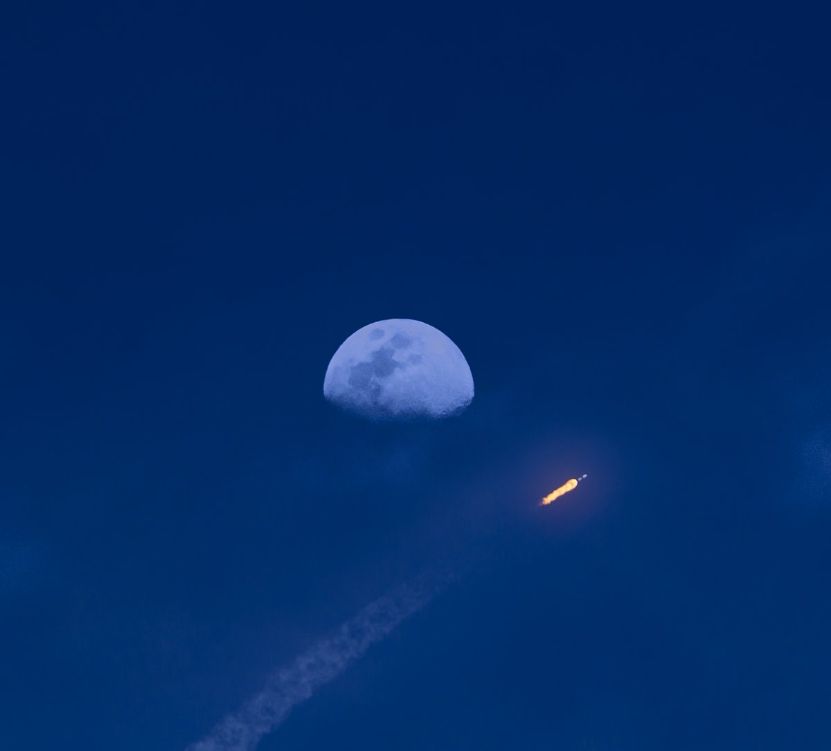 Just a @SpaceX #Falcon9 rocket and a 69% #WaxingGibbousMoon