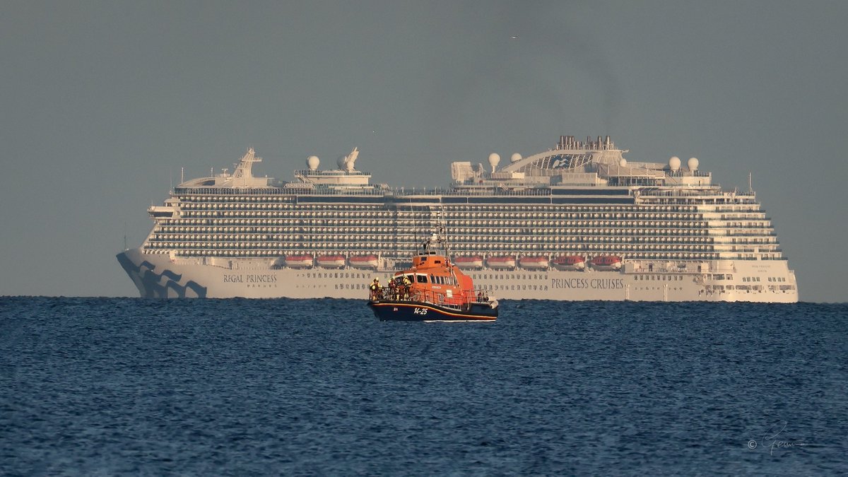 Thank you to @BC_Gemma who shared this fantastic photo she took of @BallycottonRNLI lifeboat, the ‘Austin Lidbury last night while out on exercise in Ballycotton Bay with the Regal Princess cruise liner in the background en route to Dun Laoghaire.