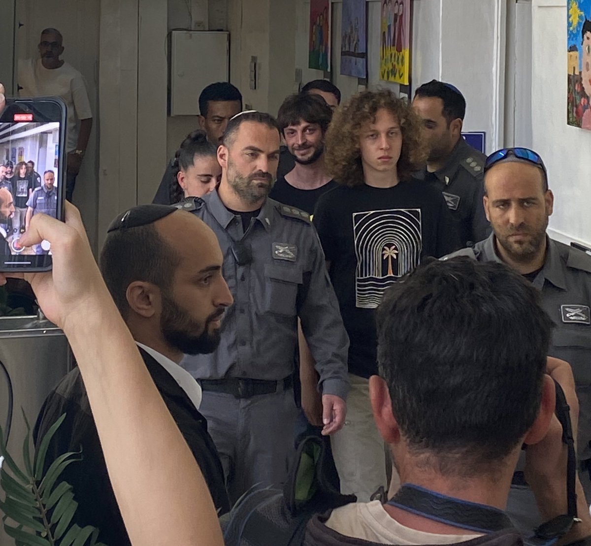 The kid with hair is my eldest son, Neta. Handcuffed (in the legs too - he is that dangerous). He got arrested yesterday in a protest for the hostages. Released now with no conditions. Well done, police. Well done 🙄