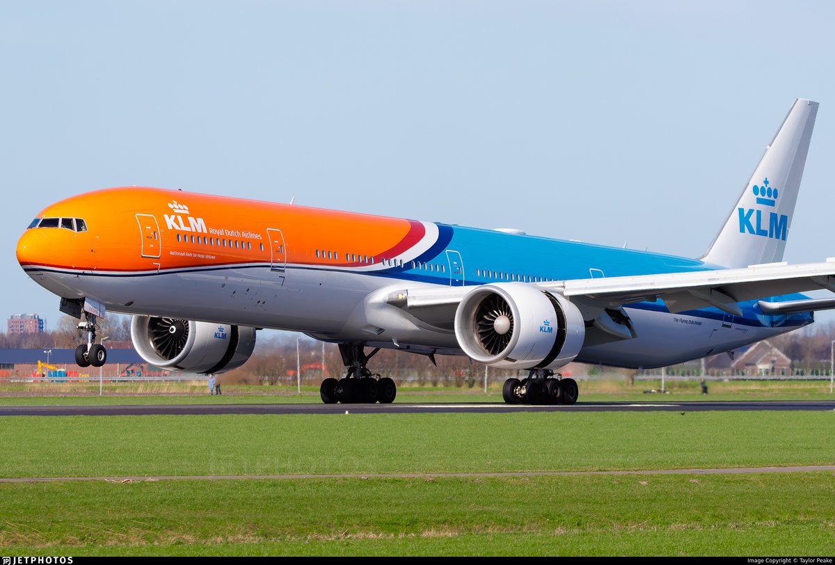 KLM’s <a href="/KLM/">KLM</a> Orange Pride livery 777 landing in Amsterdam <a href="/Schiphol/">Schiphol</a> Airport.