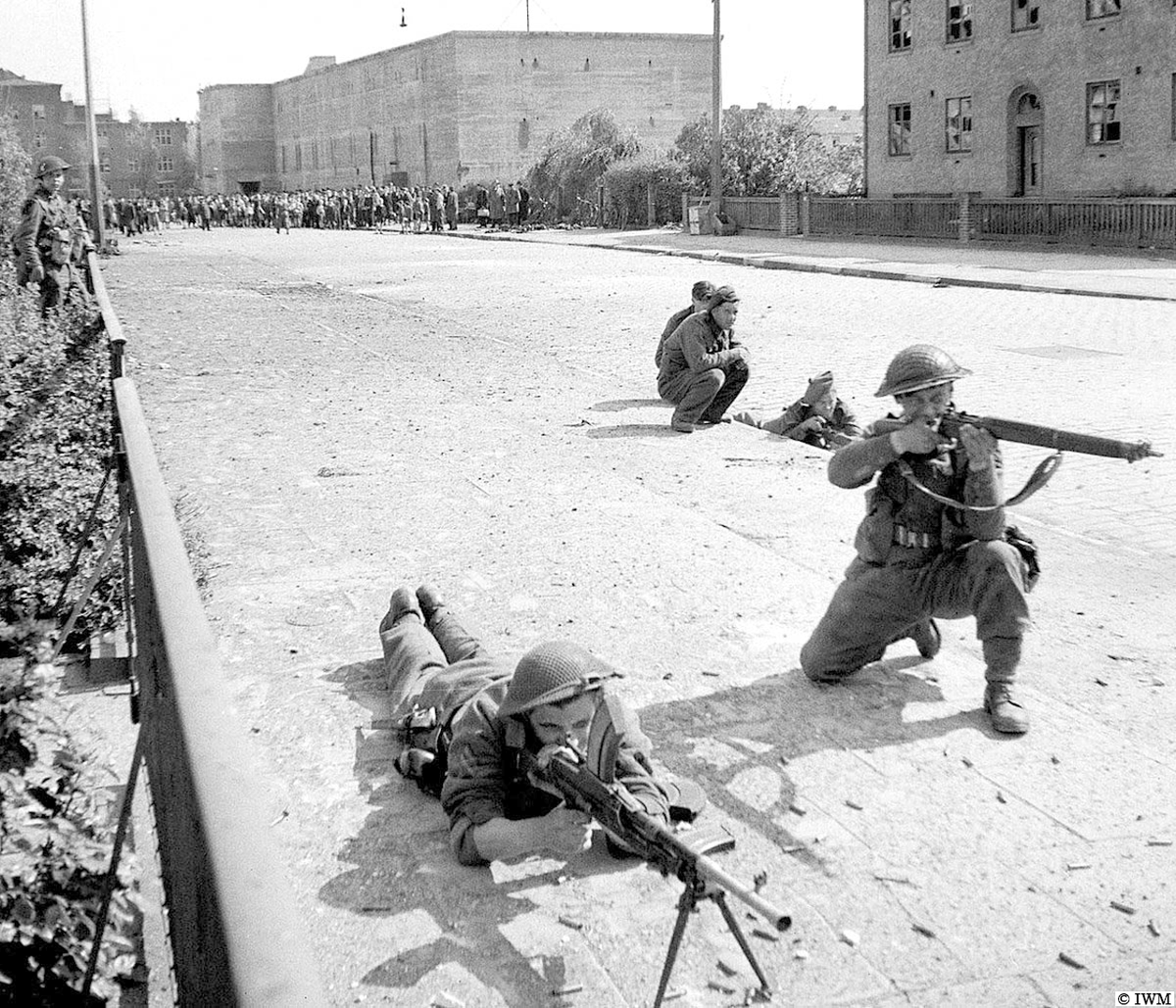 (Not posed.) #OTD in 1945, Bremen, Germany. Men from King's Own Scottish Borderers. Note the giant Luftschutzbunker in the background. #WW2 #HISTORY