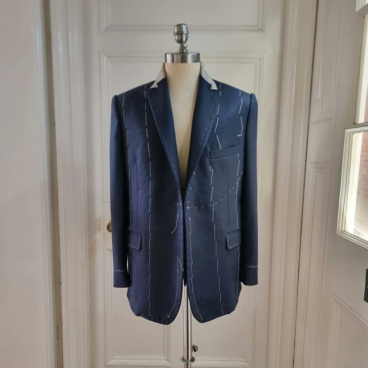 Mid make...

Full Bespoke 2-Piece made from an 18oz Herringbone wool in a greyish navy.

This particular piece of cloth is from a range of robust suitings made in the style of cloth from the past, made slowly, in more sober palettes and made to last.