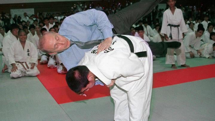 Black belt Vladimir Putin was pictured getting thrown like a rag doll during a visit to a judo school (2000).