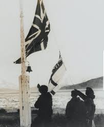 April 25th 1982: The White Ensign and Union Jack are run up as the Argentine flag is taken down. Major Guy Sheridan sends a now famous message to London: 'Be pleased to inform Her Majesty that the White Ensign flies alongside the Union Jack in South Georgia. God save the Queen.'