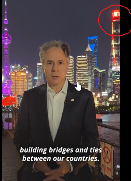 The slogan scrolling in LEDs on the skyscraper behind US Secretary of State Anthony Blinken reads -

'The People's Navy is loyal to the CPC.'😀
