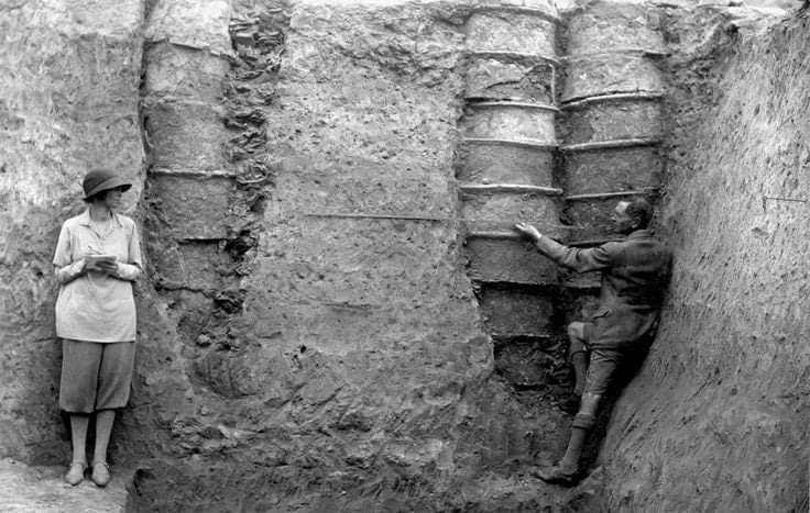 British archaeologist Leonard Woolley and his wife Katharine in front of pottery pipes that were part of what's considered the first water drainage system in history (pre 4000 bc) in the ancient Mesopotamian city of Ur. 1930.