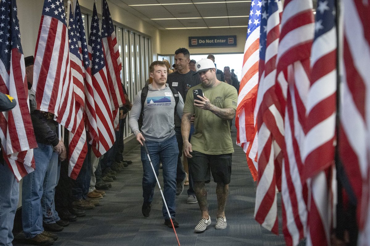 FlySJC's tweet photo. A lot of beautiful moments and expressions of love happen at airports. This is one of them, for our veterans.

Last month, a number of military vets flew into SJC to participate in #OperationSurf in #SantaCruz. 

(Photos by Roger Aguirre Smith.) [1/3] https://t.co/AoiuJ8GLSh