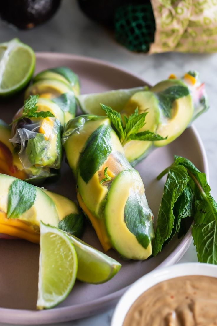 Fresh avocado summer rolls wrapped in rice paper and filled with sweet mango and crisp vegetables are the no-cook meal you need on warm days. dlvr.it/T5fNqL