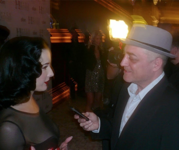 Me interviewing Dita years back. Look at that hat. I loved that hat! haha. Anywho ... we're seeing her tonight. This'll be my third time. She's always great. Though I have a naive hope she'll add a Mardi Gras move and throw us beads or cups.