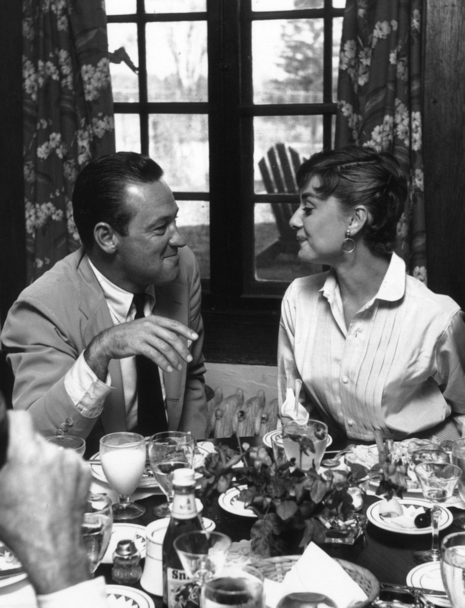 remembering william holden, who was born on this day (april 17) in 1918 here, photographed with audrey hepburn on the set of ‘sabrina’ in 1953. they also worked together in ‘paris when it sizzles’ (1964)