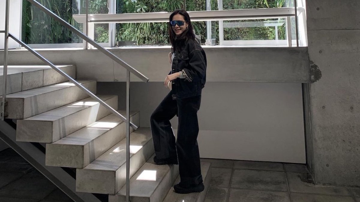 just a 42-year-old baby and her onesie and her backpack and her keychains and her husband’s merch 🧸