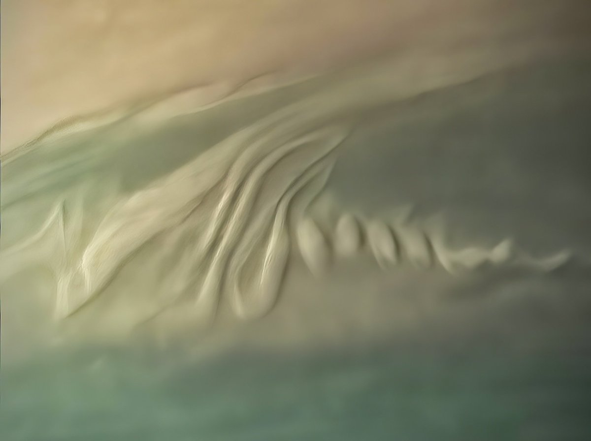 Drifting clouds into Saturn's atmosphere, captured by the Cassini spacecraft.
