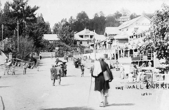The Mall Murree, 1930 (c) One of those postcards that illustrates the elasticity of time. The protagonist in the foreground is blurry because of the long exposure, perhaps a second or two, that the photographer required for the shot. Someone towards the left in the entryway to…