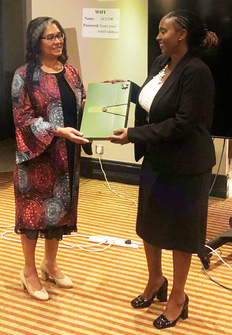 Global Health Workforce Programme - Kenya Launch. PS Ms. Mary Muthoni Muriuki receives inception report from Eduarda Gray, Deputy Development Director, British High Commission Nairobi, Kenya.