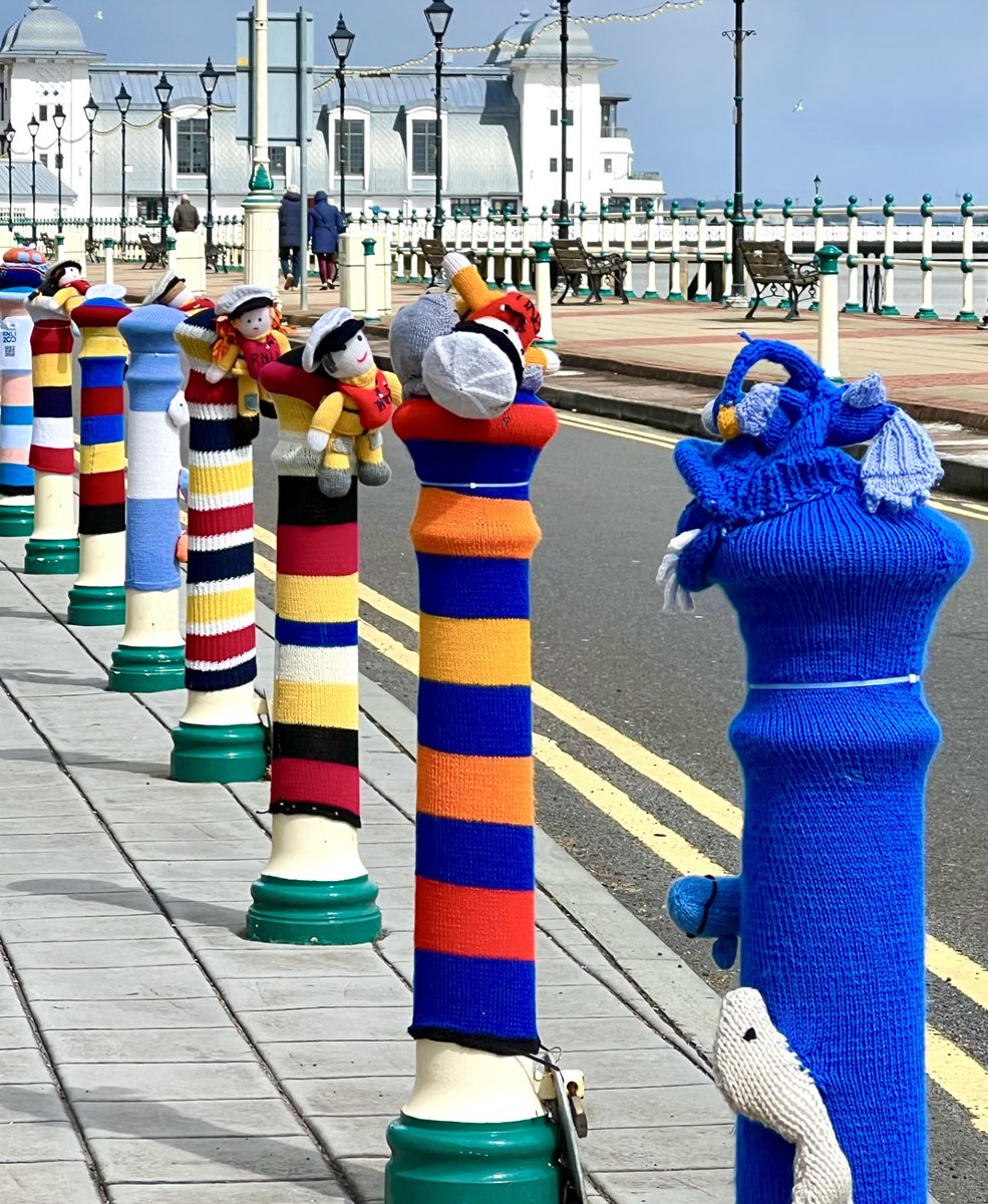 RNLI 200th Anniversary - colourful knitted covers for bollards on Penarth esplanade to mark the anniversary