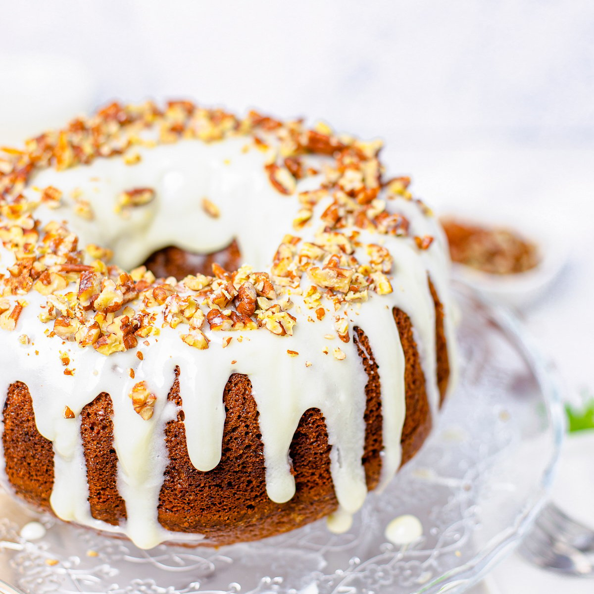 Hummingbird Cake (Best Bundt Cake Recipe) Deliciously easy and filled with banana and pineapple flavors, this Hummingbird Cake in bundt form is a moist and tasty cake that is perfect all year round. #recipes #cooking #baking #foodies therecipecookbook.com/go/qtvf