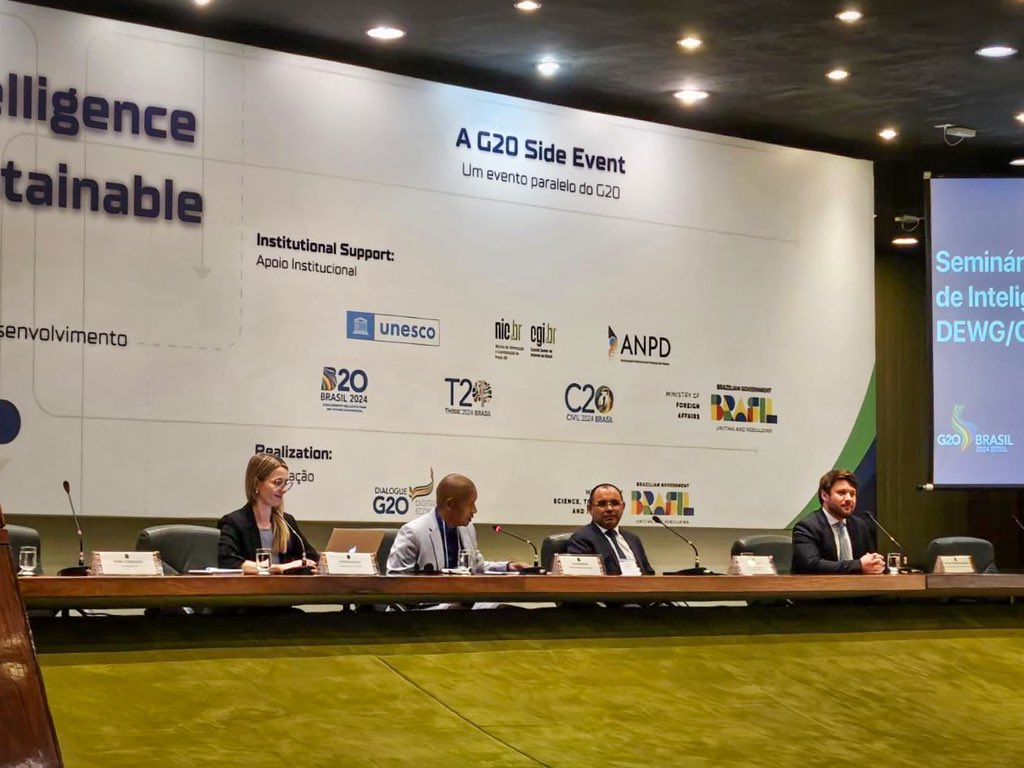 CommsZA's tweet photo. DCDT officials (Ali Mashishi, Alfred Mmoto, Jeannette Morwane and Jim Patterson attending G20 Digital Economy Working Group in Brazil in preparation for SA hosting G20 in 2025. Here they are leading the AI Summit as a side event in Brazil. https://t.co/fyRqYZFTZN