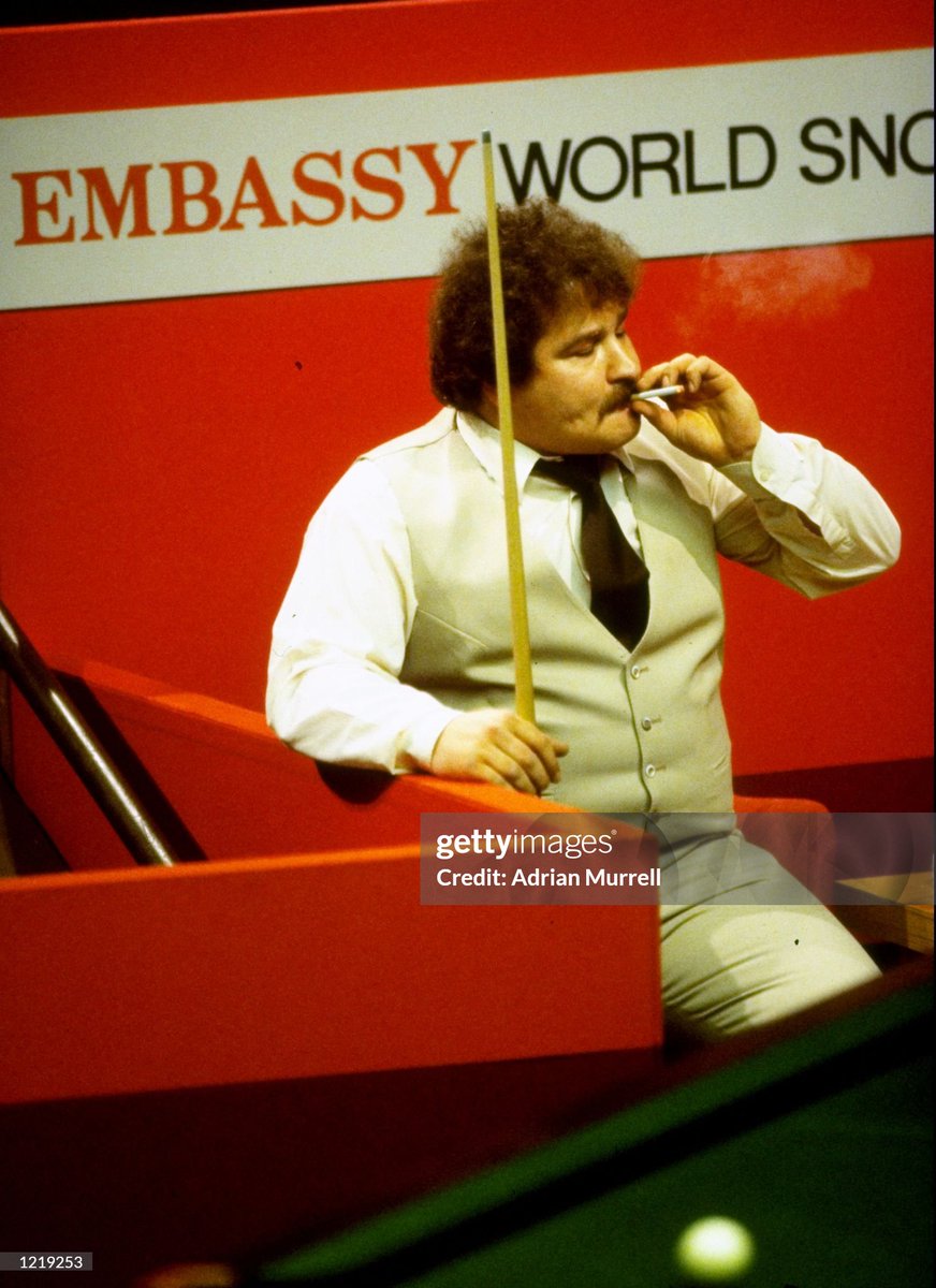 Bill Werbeniuk of Canada relaxes between shots during the Embassy World Snooker Championships at the Crucible Theatre in Sheffield, England (1983)