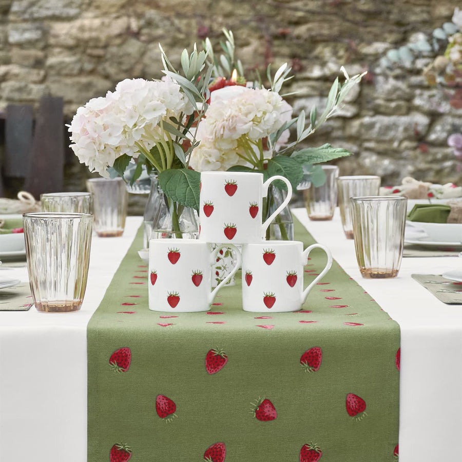 Brighten your table with fruit and vegetable themed plates, bowls, table linen inc this strawberry table runner from @SophieAllport #interiorstrend #tableware bit.ly/3xQ4T8j