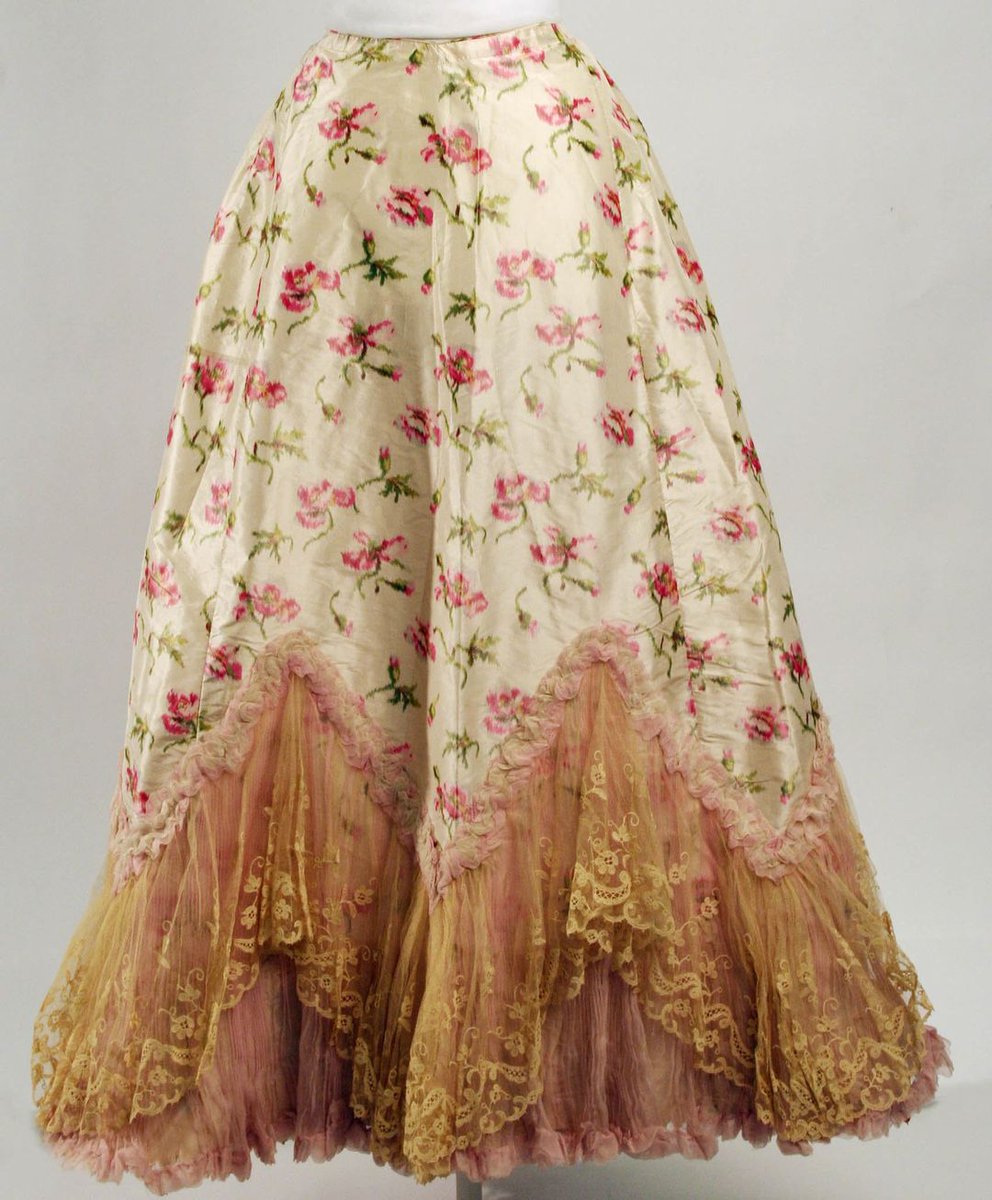 The MET holds this splendid example of a petticoat from the 1890s. Made in France, it has a floral printed silk upper with a white background. The lover section is densely pleated silk chiffon that is edged with matching colored ribbon. Thanks to Attire's Mind for sharing.