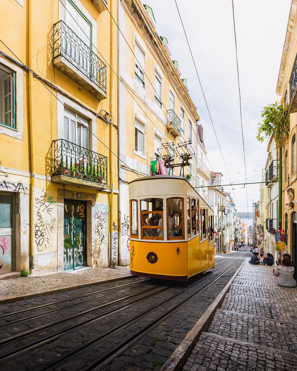 This nineteenth-century funicular ascends one of Lisbon's steepest hills between Rua de São Paulo and Largo do Calhariz via Rua da Bica de Duarte Belo. #VisitLisboa visitlisboa.com 📍 Elevador da Bica 📷 @voyageursfrancais