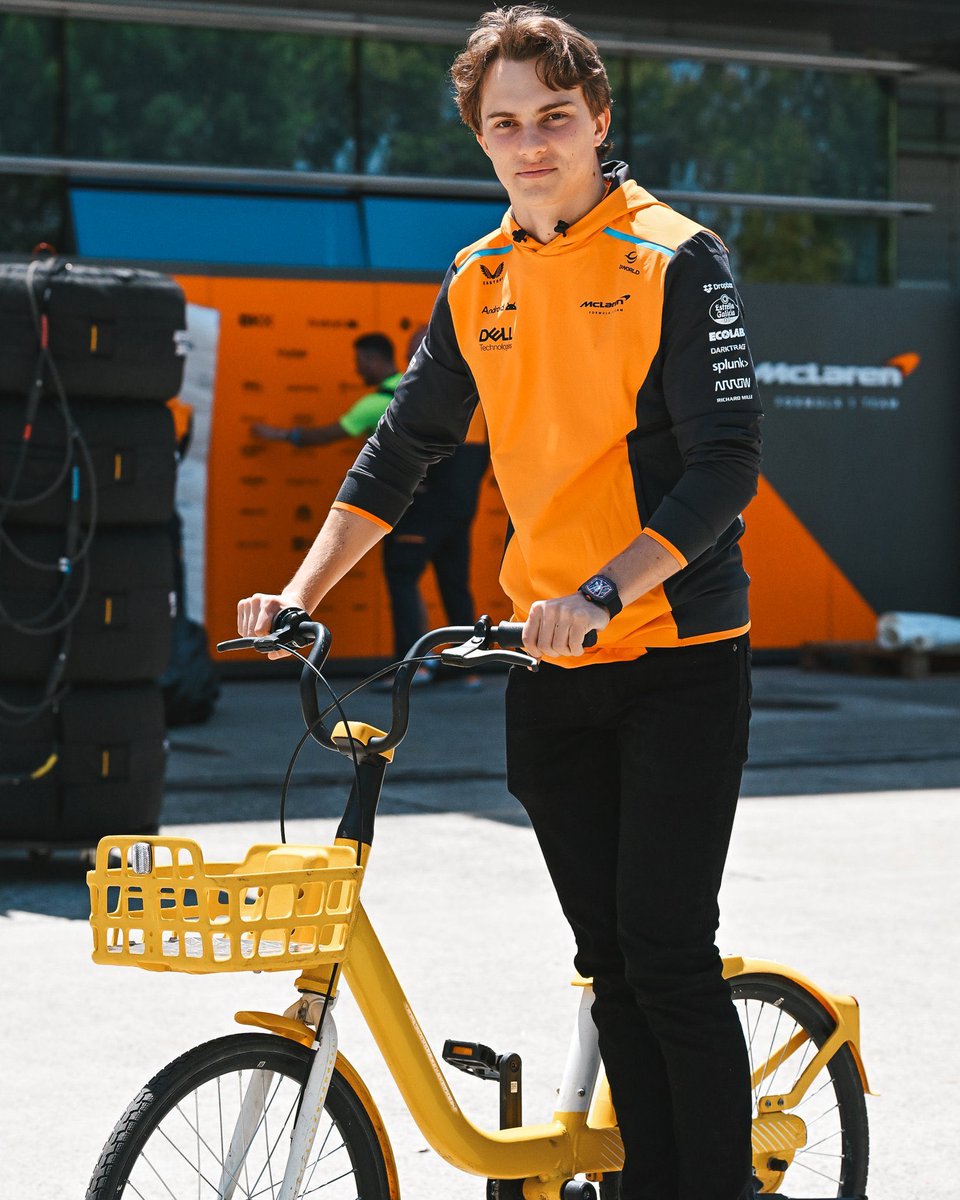 oscar proving zandvoort is Also his homerace (wearing orange + he has a bike)