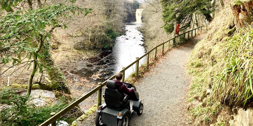 High Force Waterfall is one of the North Pennines Outdoor Mobility Tramper hire site locations🦼🌳

The Tramper route starts from the hotel and winds gently down through the woodland above the river before the dramatic falls reveals itself

Find out more - bit.ly/3KfLOzQ