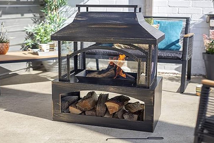 Love this log burner pit with wood storage! 🔥 It’ll make a gorgeous talking point for the patio. Check it out here ➡️ awin1.com/cread.php?awin…